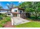 Rear exterior view showing a multi-level covered porch at 5549 Aragon Ave, De Leon Springs, FL 32130
