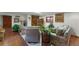 Spacious living area featuring tile floors, neutral colored walls, and ample seating perfect for gatherings and relaxation at 5549 Aragon Ave, De Leon Springs, FL 32130
