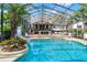 Enclosed pool showcasing its size and design, with a slide and sunbathing area at 5549 Aragon Ave, De Leon Springs, FL 32130