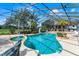 This enclosed pool features a slide and plenty of room for fun, all under a screened enclosure at 5549 Aragon Ave, De Leon Springs, FL 32130