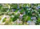 Gorgeous aerial view of the home nestled among mature trees, lush landscaping, and neighboring houses at 6 Leisure Wood Way, Ormond Beach, FL 32174