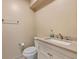 Clean, neutral bathroom with white cabinetry, hardware, and a tiled floor at 6 Leisure Wood Way, Ormond Beach, FL 32174