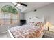Bedroom with a large window, ceiling fan, and bright decor at 6 Leisure Wood Way, Ormond Beach, FL 32174