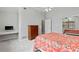 Comfortable bedroom with a work desk, dresser, and an ensuite bathroom at 6 Leisure Wood Way, Ormond Beach, FL 32174