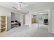 Bedroom with carpeted floors, built-in desk, and closet with mirrored doors at 6 Leisure Wood Way, Ormond Beach, FL 32174