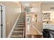 Spacious foyer featuring stairs leading to the second floor and built-in shelving at 6 Leisure Wood Way, Ormond Beach, FL 32174