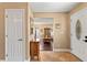 Inviting foyer featuring tile floors and views into the adjacent living spaces with hardwood flooring at 6 Leisure Wood Way, Ormond Beach, FL 32174
