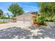 Three-car garage and large parking area, ideal for car enthusiasts and providing space for various vehicles and projects at 6 Leisure Wood Way, Ormond Beach, FL 32174