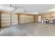Large three car garage with two automatic doors providing ample parking at 6 Leisure Wood Way, Ormond Beach, FL 32174