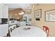 Bright, open kitchen featuring granite countertops, stainless appliances and white cabinetry at 6 Leisure Wood Way, Ormond Beach, FL 32174