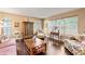 Cozy living room with hardwood floors, abundant natural light, and stylish furnishings at 6 Leisure Wood Way, Ormond Beach, FL 32174