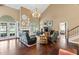 Spacious living room with high ceilings, fireplace, hardwood floors and ample natural light at 6 Leisure Wood Way, Ormond Beach, FL 32174