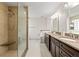 Beautifully renovated main bathroom with walk-in shower, granite countertops and dual sinks at 6 Leisure Wood Way, Ormond Beach, FL 32174