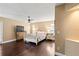 Cozy main bedroom with hardwood floors, ceiling fan, and lots of natural light at 6 Leisure Wood Way, Ormond Beach, FL 32174