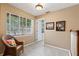 Upstairs office space with natural lighting, a comfortable chair, and neutral tones at 6 Leisure Wood Way, Ormond Beach, FL 32174