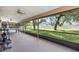 A well-lit screened patio overlooking the lush backyard at 6 Leisure Wood Way, Ormond Beach, FL 32174