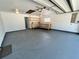 View of an oversized two-car garage with updated flooring, and an abundance of space at 600 S Parkview Ave, Orange City, FL 32763