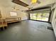 Spacious two-car garage featuring updated flooring and an abundance of natural light at 600 S Parkview Ave, Orange City, FL 32763