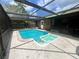 Screened-in pool area with a hot tub perfect for outdoor enjoyment and relaxation at 600 S Parkview Ave, Orange City, FL 32763
