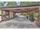 Large carport with ceiling fans that provides ample covered parking and outdoor space at 601 N Garfield Ave, Deland, FL 32724