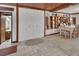 Open-concept dining area featuring tile floors, storage and a doorway to a bathroom at 601 N Garfield Ave, Deland, FL 32724