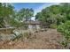Lovely home surrounded by mature trees and landscaping offers a serene and private setting at 601 N Garfield Ave, Deland, FL 32724