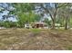 Inviting home with a well-manicured lawn and mature trees creates a warm curb appeal at 601 N Garfield Ave, Deland, FL 32724
