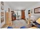 Bright living room with a large window, open doorway, and comfortable seating at 601 N Garfield Ave, Deland, FL 32724