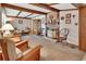 Inviting living room featuring exposed wood beams, fireplace, and comfortable seating at 601 N Garfield Ave, Deland, FL 32724