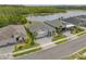 Overhead view showcasing a home near a lake, surrounded by lush greenery at 660 Mosaic Blvd, Daytona Beach, FL 32124