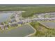 Aerial view of a community with homes surrounding multiple ponds, lush landscaping, and mature trees at 660 Mosaic Blvd, Daytona Beach, FL 32124