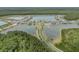 Spectacular aerial view of a well-planned community with serene lakes, lush greenery, and contemporary homes at 660 Mosaic Blvd, Daytona Beach, FL 32124