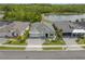 Scenic aerial shot of a home with a well-manicured lawn and water view at 660 Mosaic Blvd, Daytona Beach, FL 32124