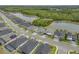 Aerial view of a new neighborhood with serene lake views and lush green surroundings at 660 Mosaic Blvd, Daytona Beach, FL 32124