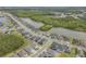 An aerial view of a community featuring well-maintained homes, tranquil ponds, and lush greenery at 660 Mosaic Blvd, Daytona Beach, FL 32124