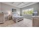 Comfortable bedroom offers a stylish bed with a decorative quilt and ample natural light at 660 Mosaic Blvd, Daytona Beach, FL 32124