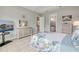 This bedroom offers tile floors, a view to the bathroom, and a trey ceiling at 660 Mosaic Blvd, Daytona Beach, FL 32124