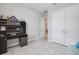 This bedroom offers ample storage with its large closet and a workspace featuring a built-in desk and shelving at 660 Mosaic Blvd, Daytona Beach, FL 32124