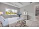 The bedroom offers a view of the lake, tile floors, and a tray ceiling at 660 Mosaic Blvd, Daytona Beach, FL 32124