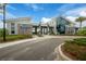 Community clubhouse featuring modern architecture and lush landscaping at 660 Mosaic Blvd, Daytona Beach, FL 32124
