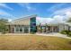 Exterior view of the community clubhouse with modern architecture and outdoor seating at 660 Mosaic Blvd, Daytona Beach, FL 32124