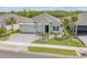 Well-maintained home showcasing lush landscaping and a paver driveway at 660 Mosaic Blvd, Daytona Beach, FL 32124