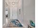 Bright foyer with tiled floor, decorative rug, and view of the home's interior at 660 Mosaic Blvd, Daytona Beach, FL 32124