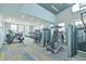 Bright gym boasts modern equipment, high ceilings, and abundant natural light from large windows at 660 Mosaic Blvd, Daytona Beach, FL 32124