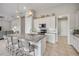 Modern kitchen with a center island, granite countertop, stainless steel appliances, and pendant lighting at 660 Mosaic Blvd, Daytona Beach, FL 32124
