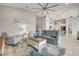 Bright living room with comfortable seating, modern ceiling fan, and open floor plan at 660 Mosaic Blvd, Daytona Beach, FL 32124