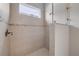 The shower features tiled walls, tiled floors, and a window at 660 Mosaic Blvd, Daytona Beach, FL 32124