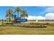 Community sign reads 'Mosaic' and features palm trees, landscaping, and water view at 660 Mosaic Blvd, Daytona Beach, FL 32124