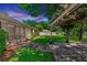 Landscaped backyard with a covered patio, brick pavers, and a screened porch on a charming single-Gathering home at 68 Spring Lake Dr, Debary, FL 32713