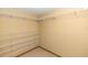 Walk-in closet featuring adjustable wire shelving to maximize storage, and neutral carpet at 68 Spring Lake Dr, Debary, FL 32713
